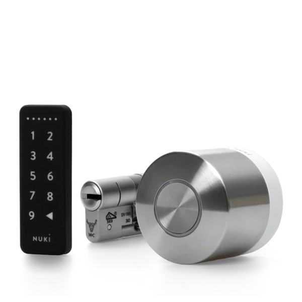 Silver door lock mechanism with digital keypad on a white background