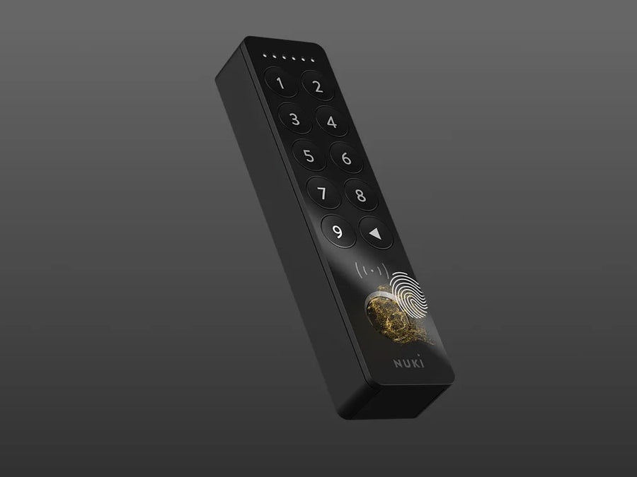 Black electronic device with keypad and fingerprint sensor on a gray background