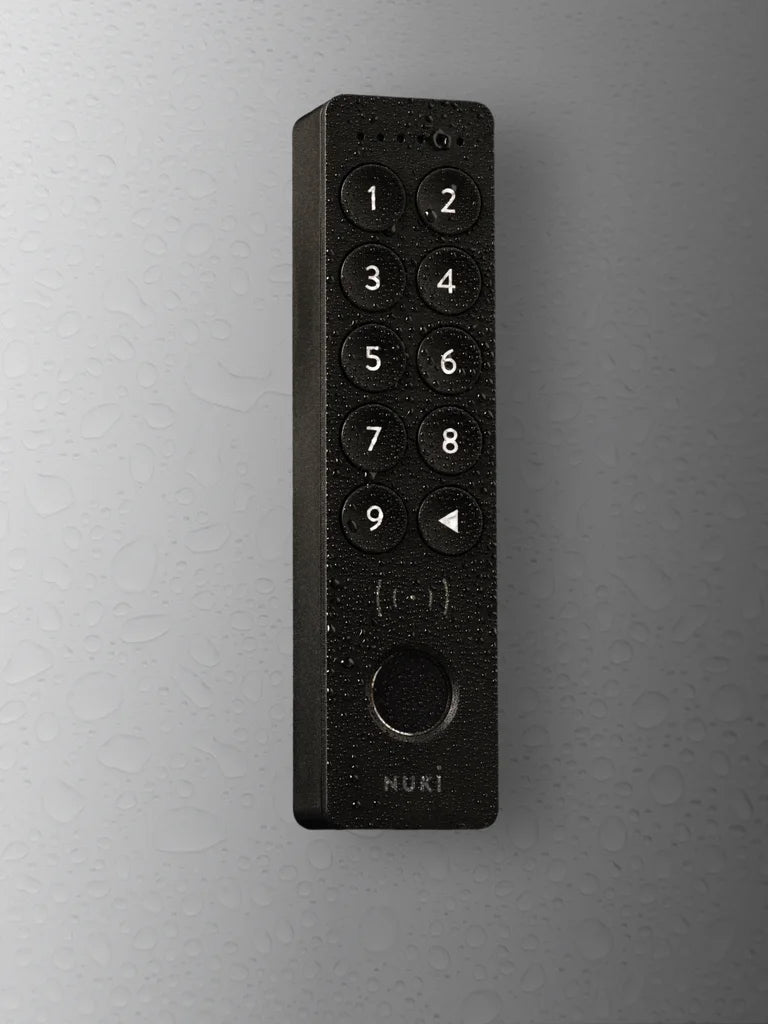 Black keypad on a gray wall